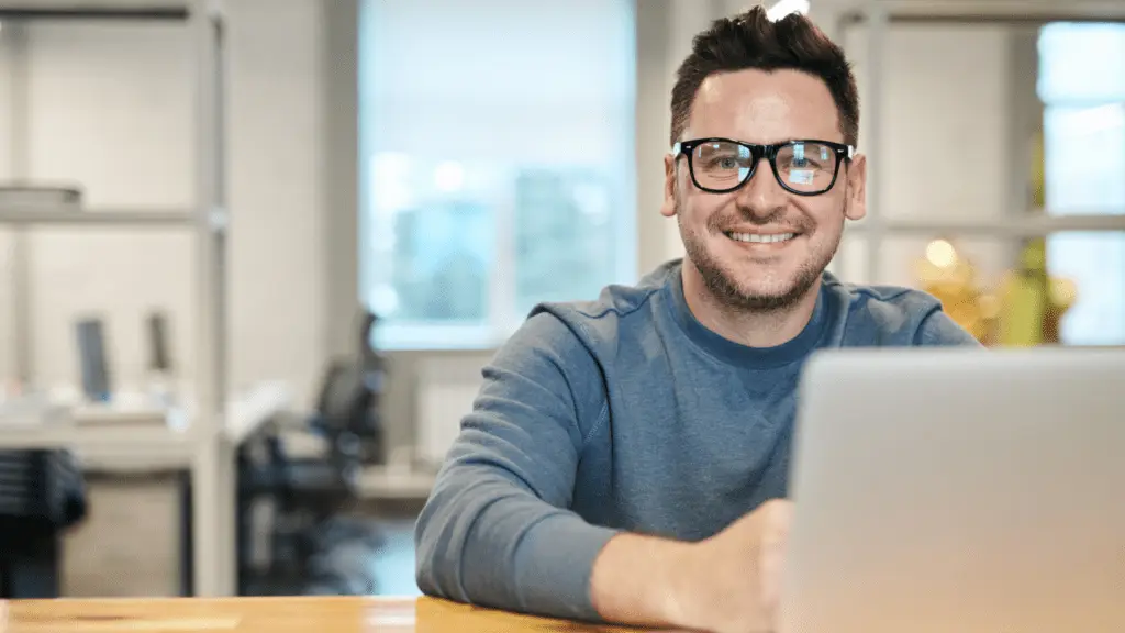 Man in office working on new laptop