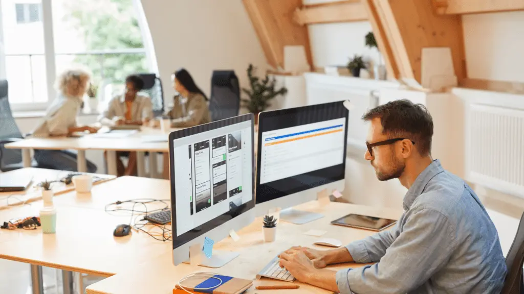 Man using software subscriptions onon laptop